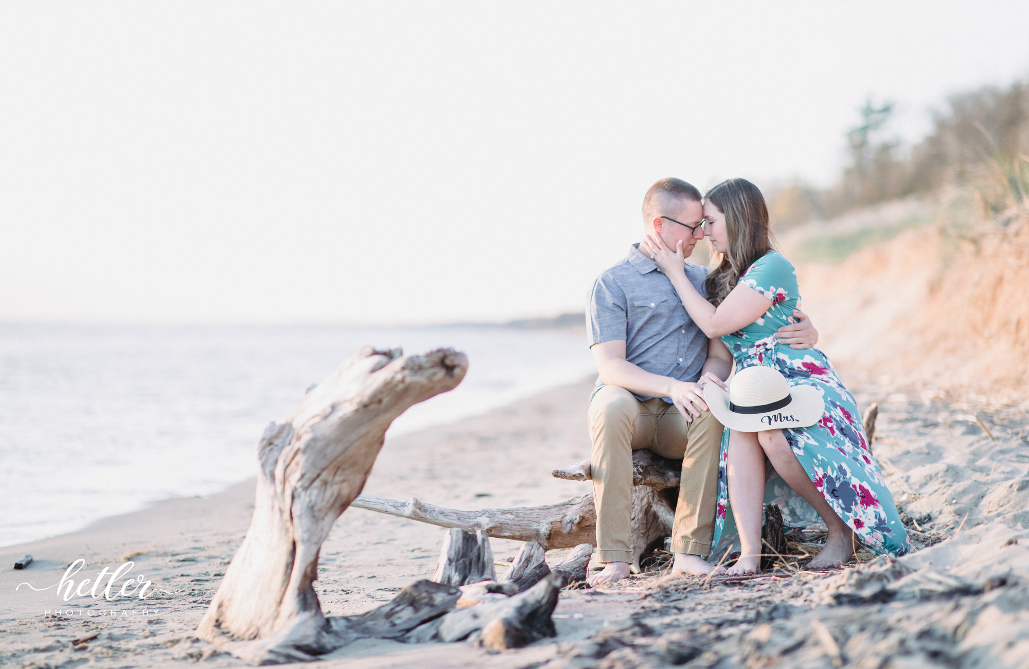 Grand Haven light and airy romantic beach engagement pics
