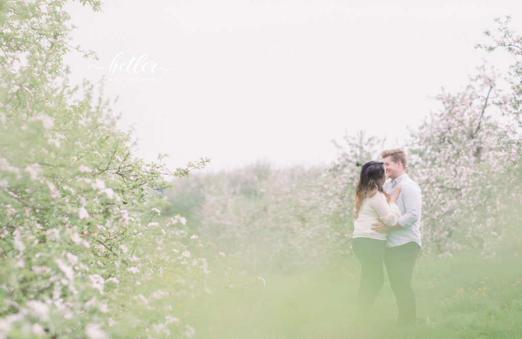 Grand Rapids spring engagement photos in apple blossoms Res Life worship team