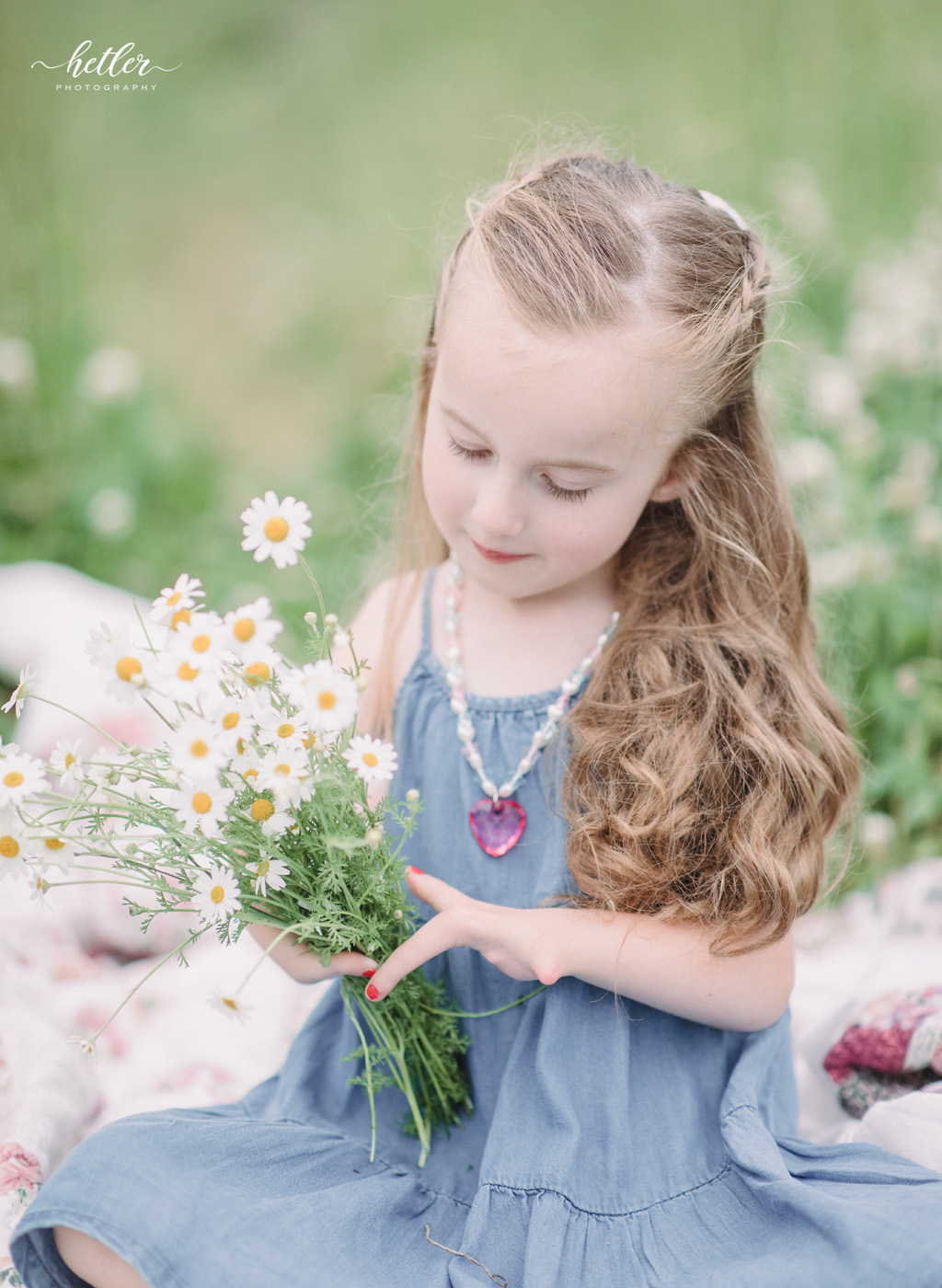 Grand Rapids light and airy family photos in a wildflower field with a lucky fin daughter