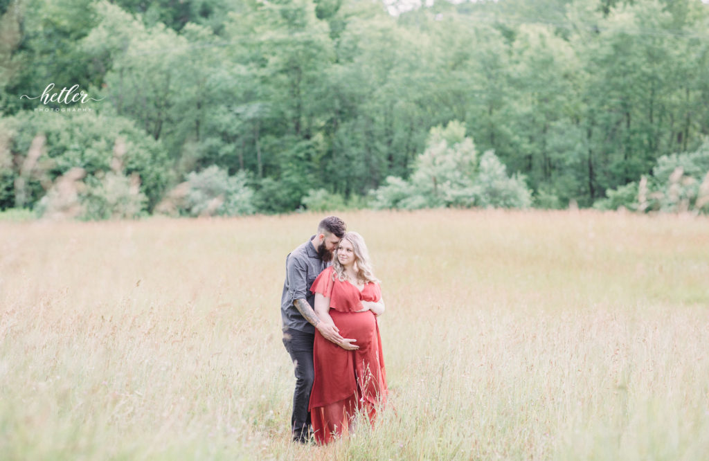 Fremont Michigan maternity photography in hay field