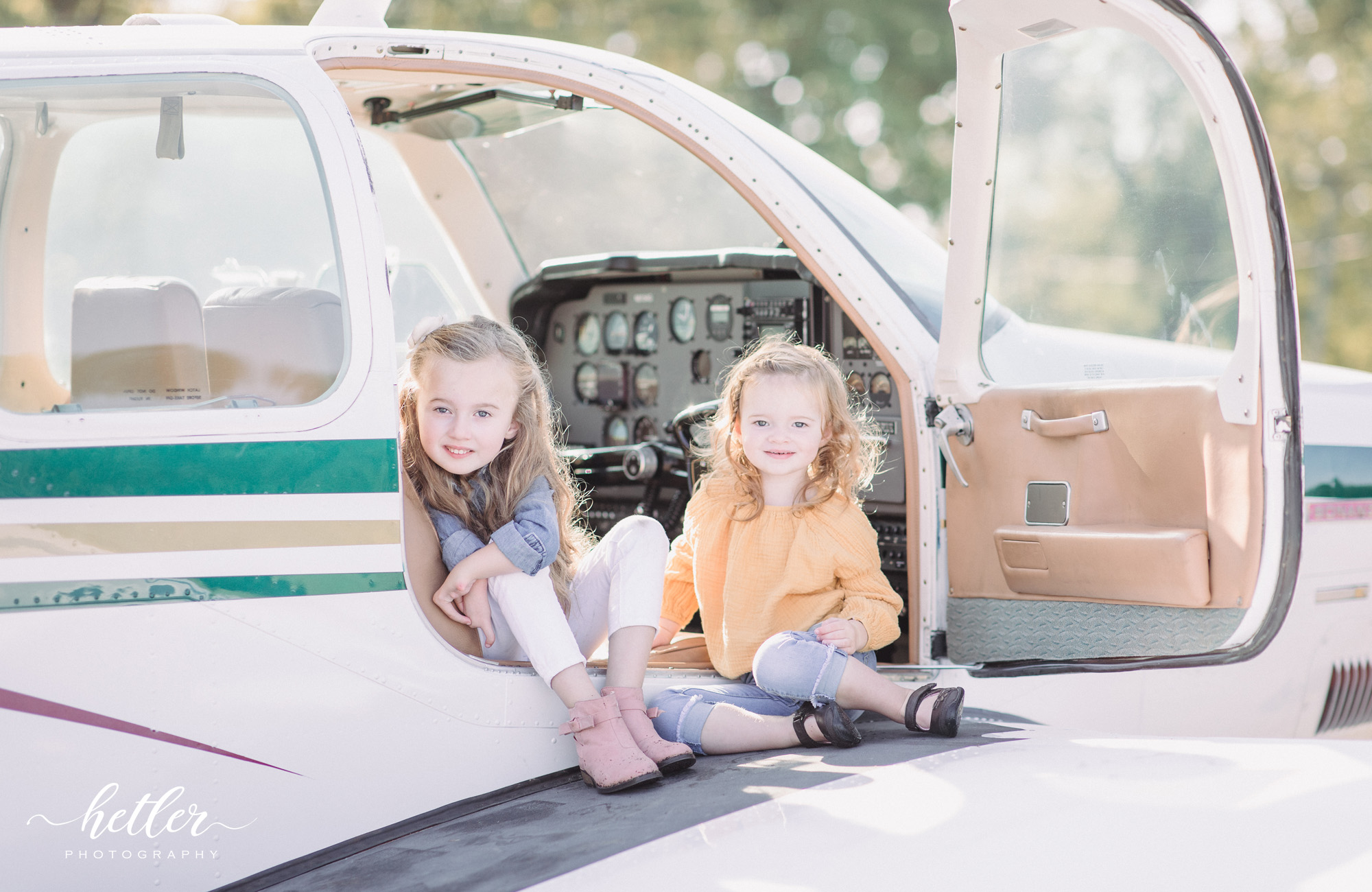 Lowell Airport family session with a personal aircraft