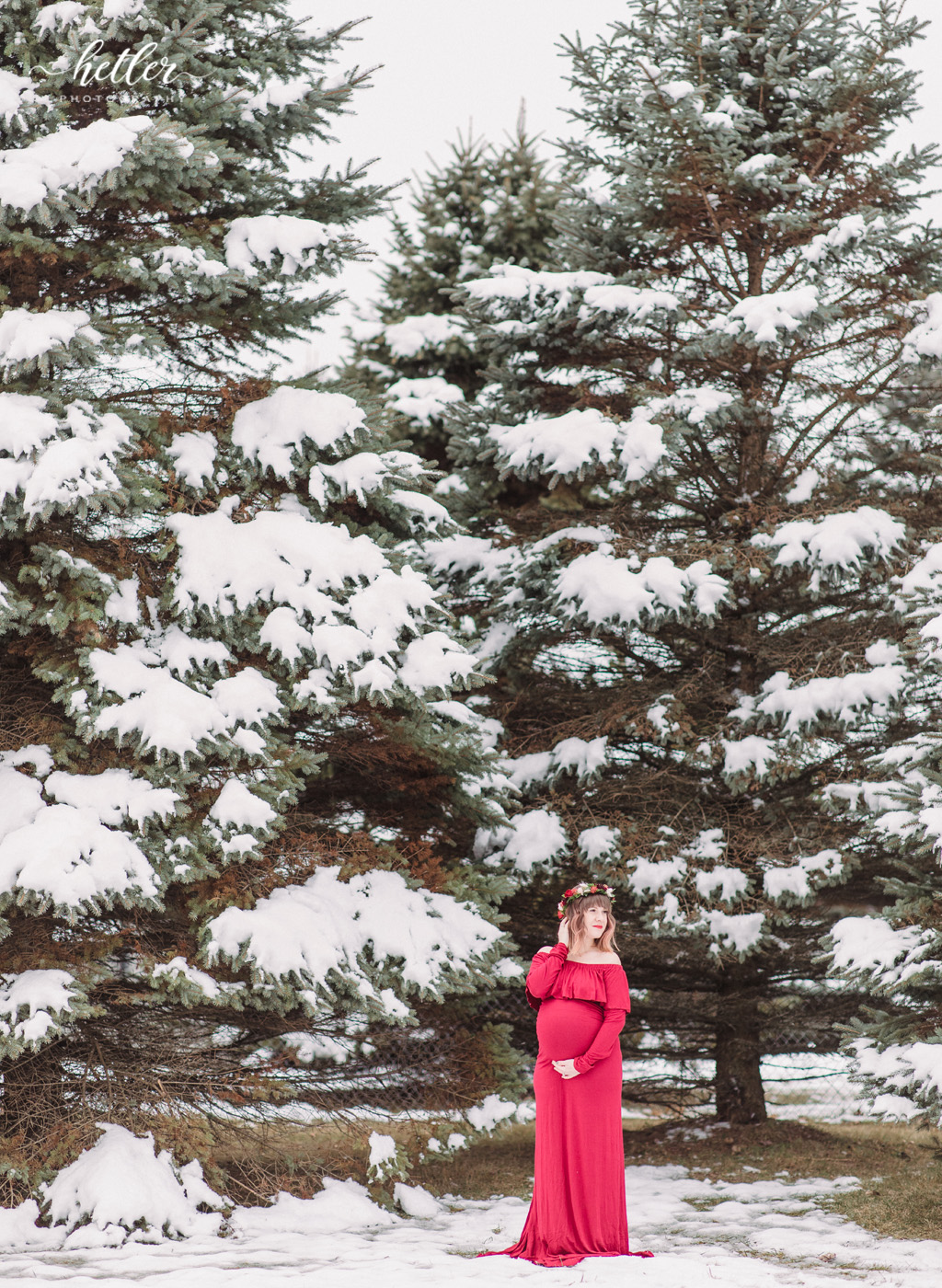 Grand Rapids winter maternity photo session with a red dress and a flower crown from Fleurology Designs
