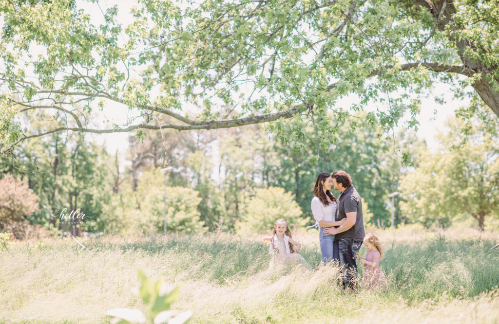 Family photos in Grand Rapids, Michigan at The Higlands with a beautiful girl with two lucky fins