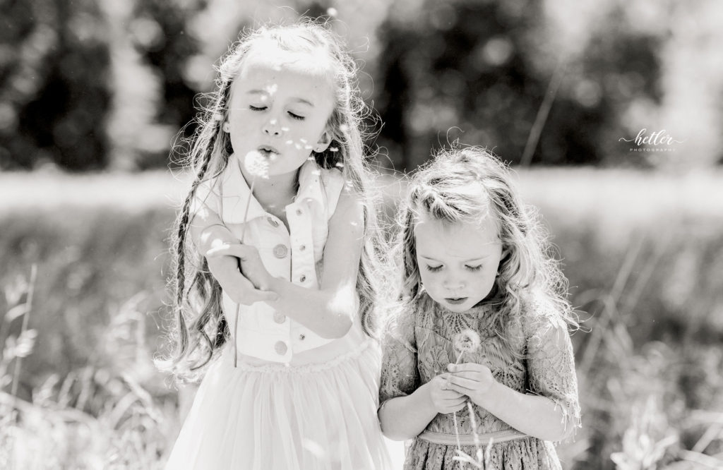 Family photos in Grand Rapids, Michigan at The Higlands with a beautiful girl with two lucky fins