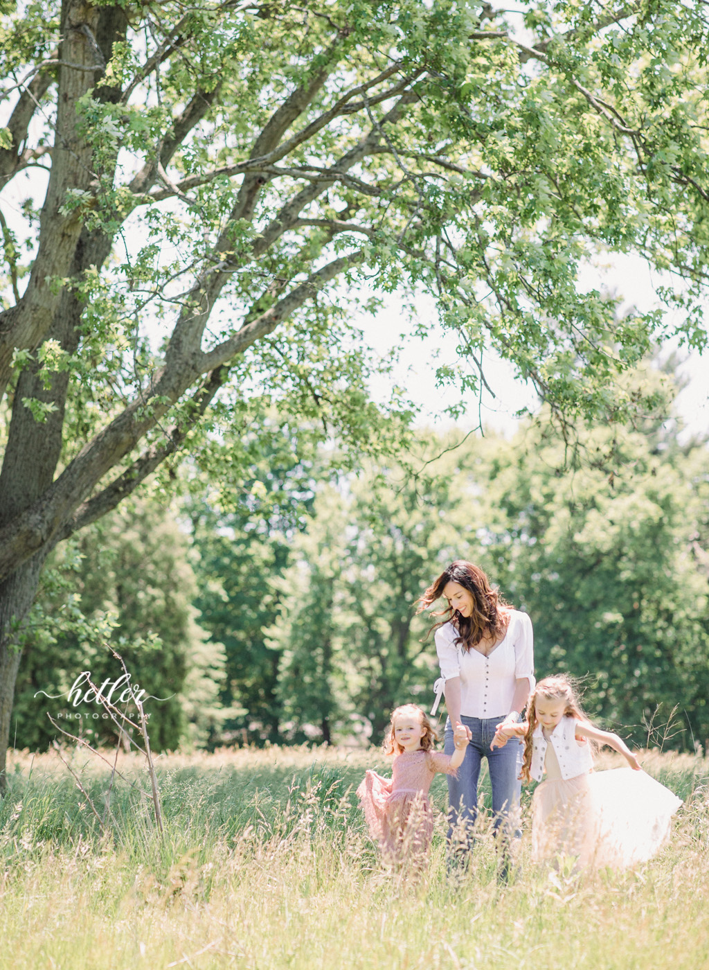 Family photos in Grand Rapids, Michigan at The Higlands with a beautiful girl with two lucky fins