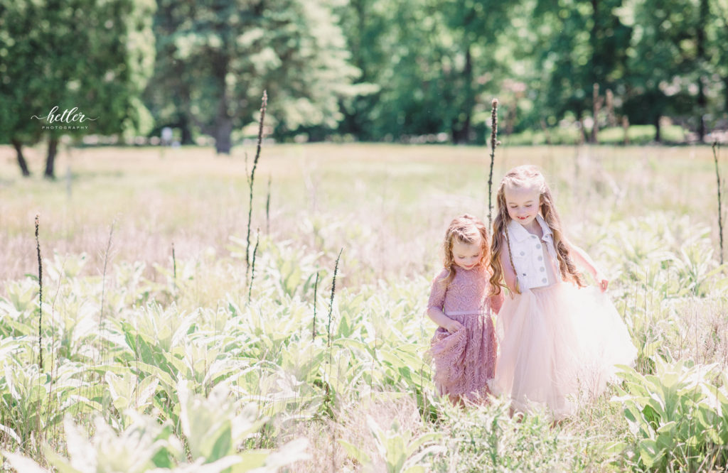 Family photos in Grand Rapids, Michigan at The Higlands with a beautiful girl with two lucky fins