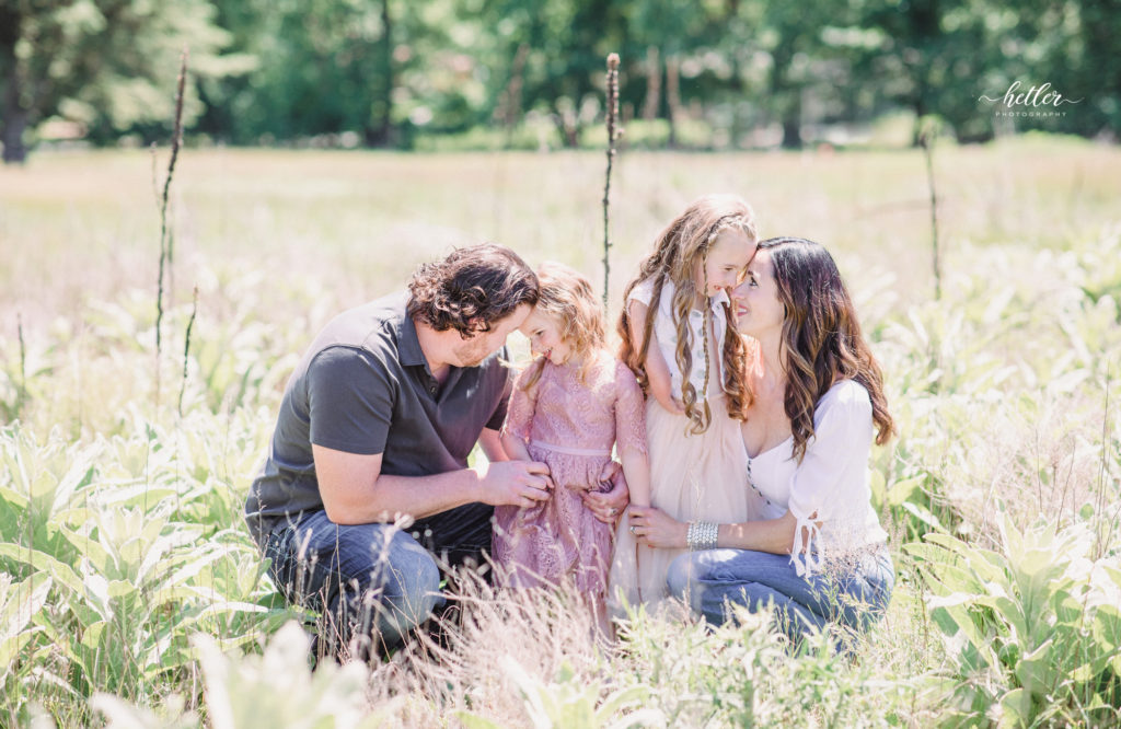 Family photos in Grand Rapids, Michigan at The Higlands with a beautiful girl with two lucky fins