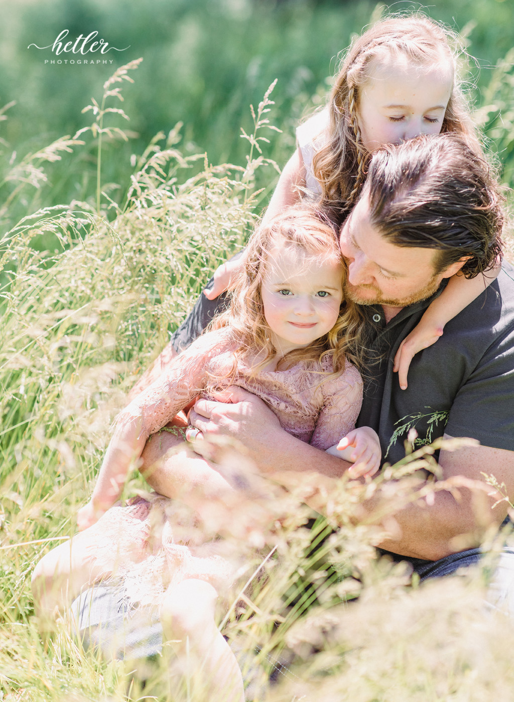 Family photos in Grand Rapids, Michigan at The Higlands with a beautiful girl with two lucky fins