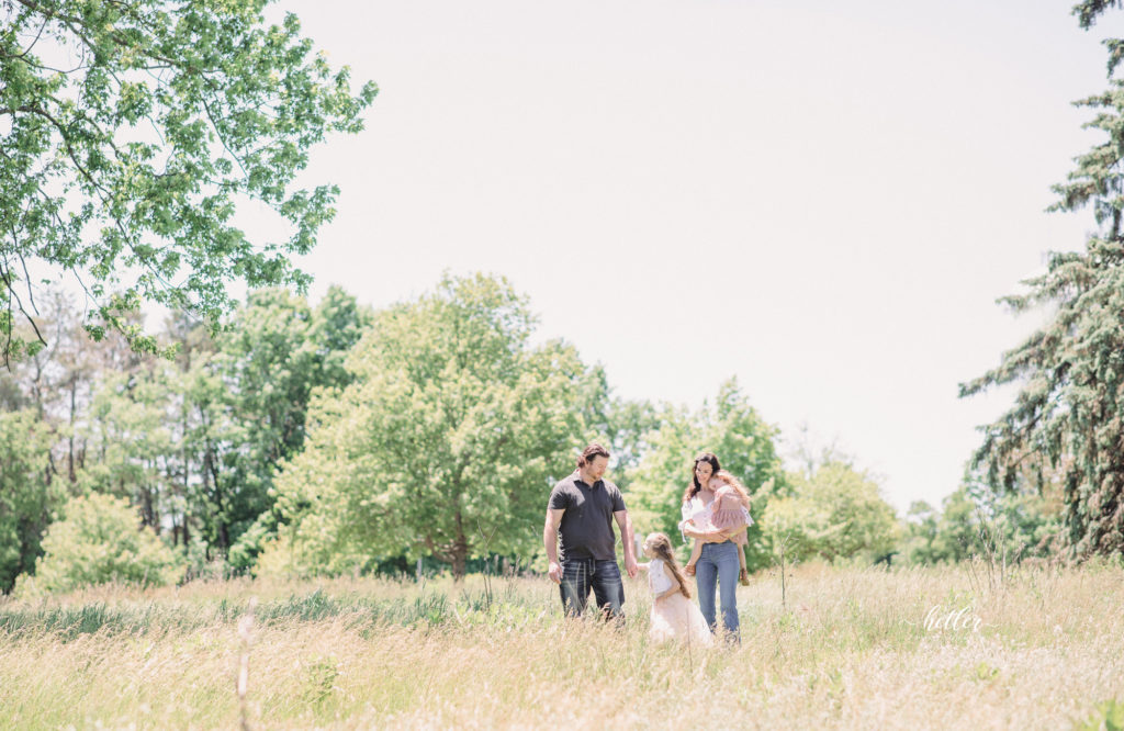 Family photos in Grand Rapids, Michigan at The Higlands with a beautiful girl with two lucky fins