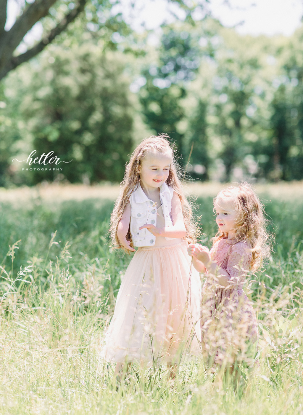 Family photos in Grand Rapids, Michigan at The Higlands with a beautiful girl with two lucky fins