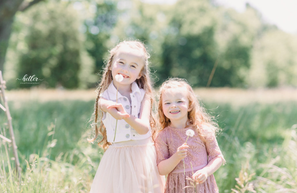 Family photos in Grand Rapids, Michigan at The Higlands with a beautiful girl with two lucky fins