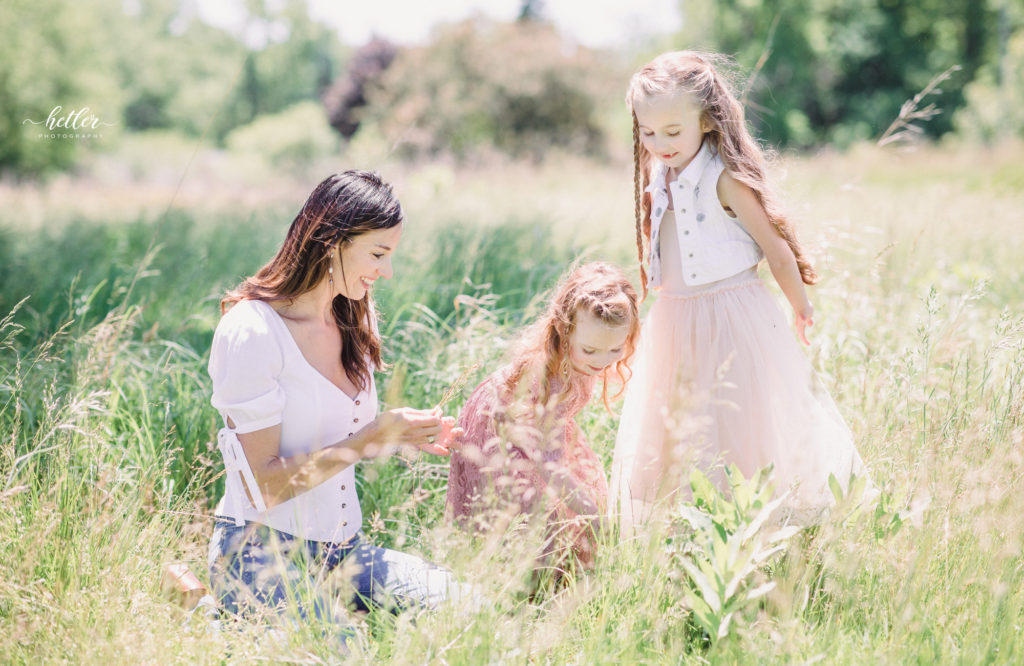 Family photos in Grand Rapids, Michigan at The Higlands with a beautiful girl with two lucky fins