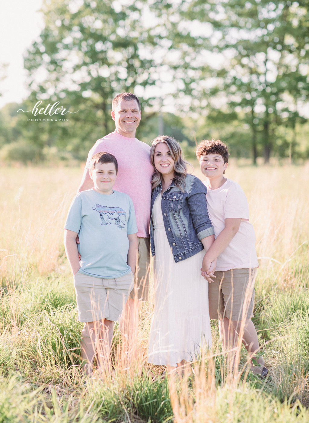 Newaygo Michigan family photos in a farm field with beautiful sunshine
