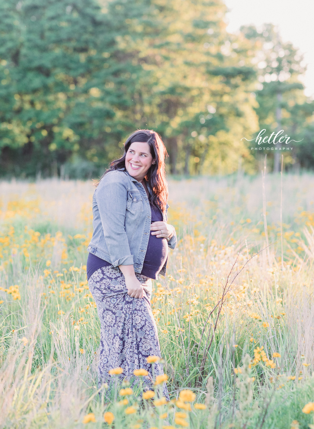 Fremont Michigan maternity photos in a field of wildflowers