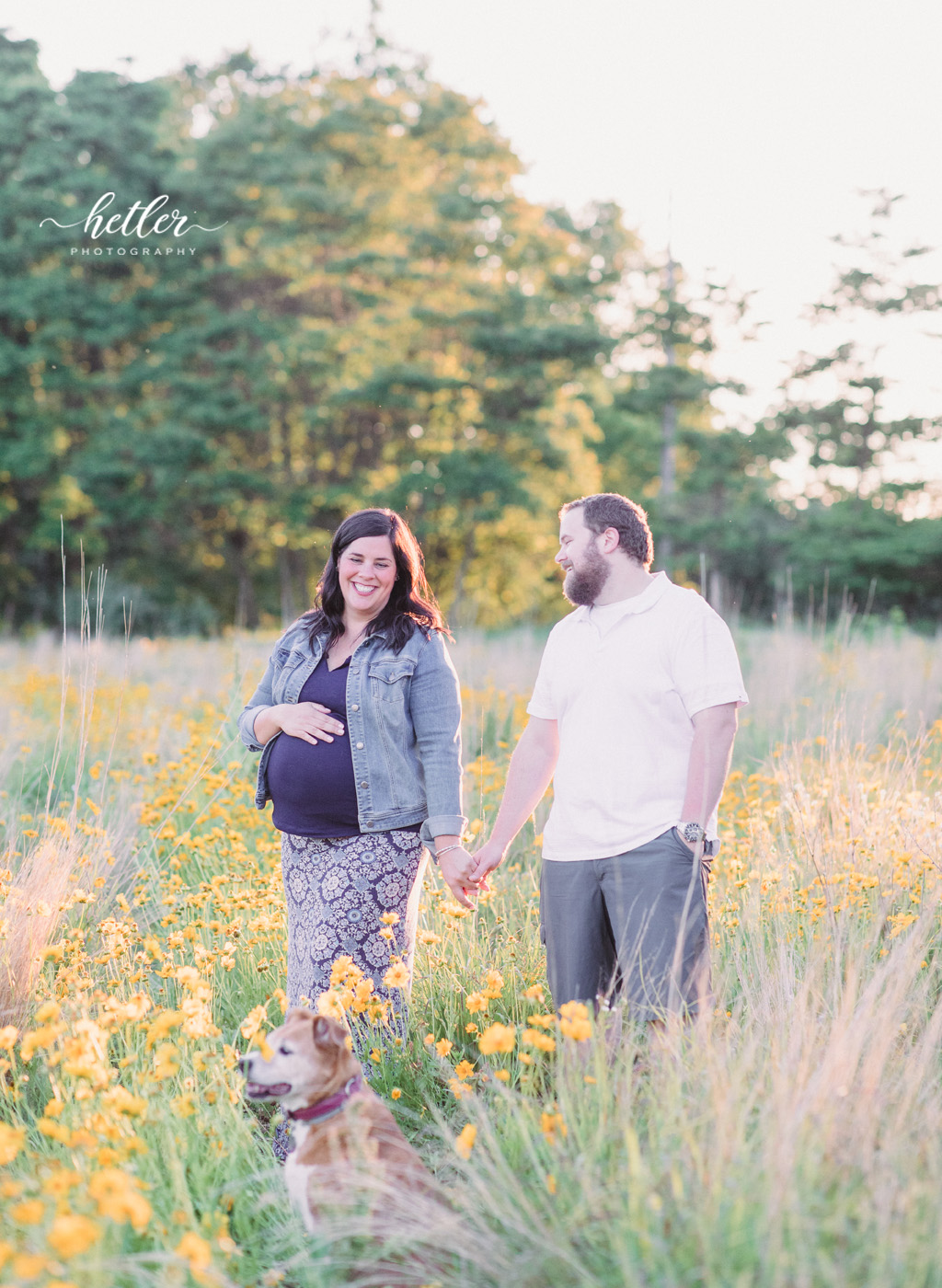 Fremont Michigan maternity photos in a field of wildflowers