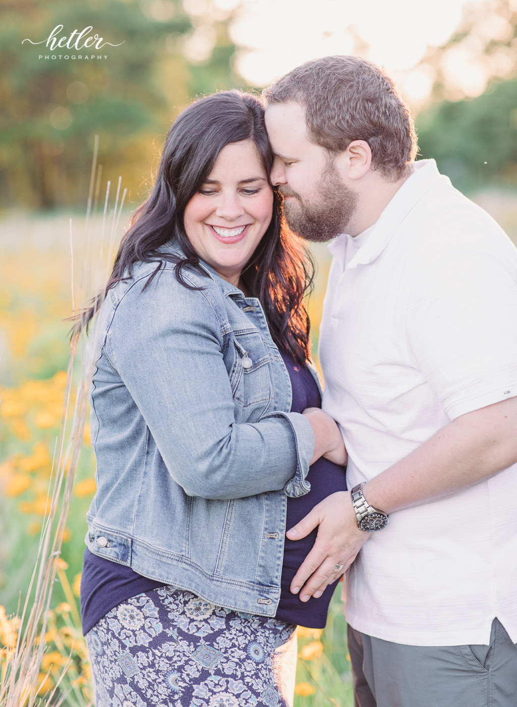 Fremont Michigan maternity photos in a field of wildflowers