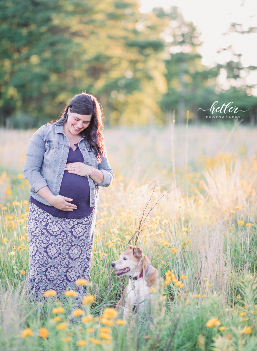 Fremont Michigan maternity photos in a field of wildflowers