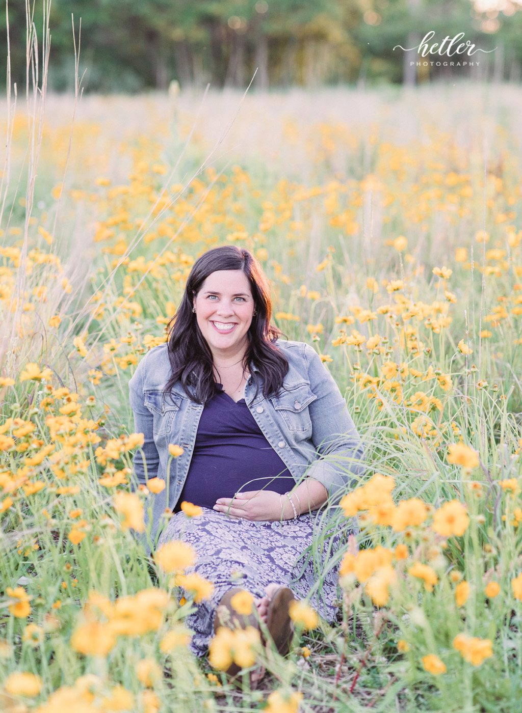 Fremont Michigan maternity photos in a field of wildflowers