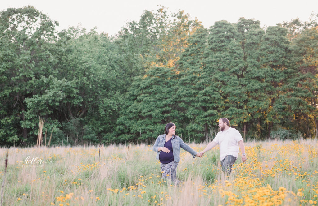 Fremont Michigan maternity photos in a field of wildflowers