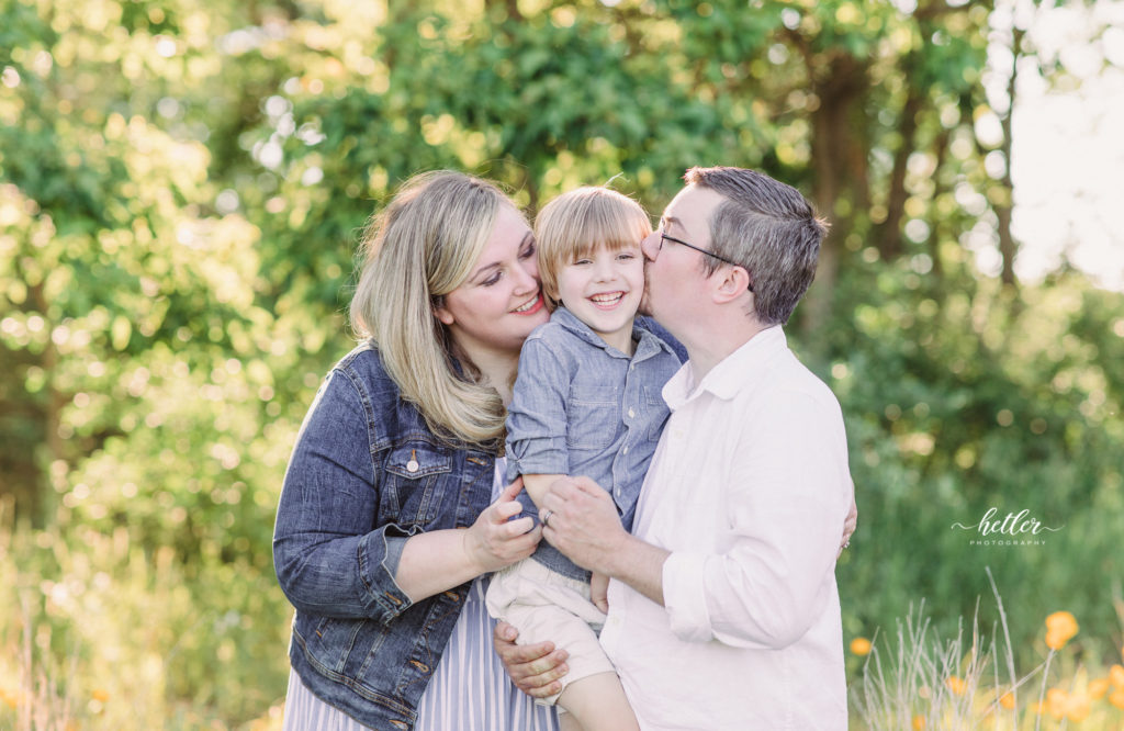 Fremont Michigan family photos in a field of yellow wildflowers