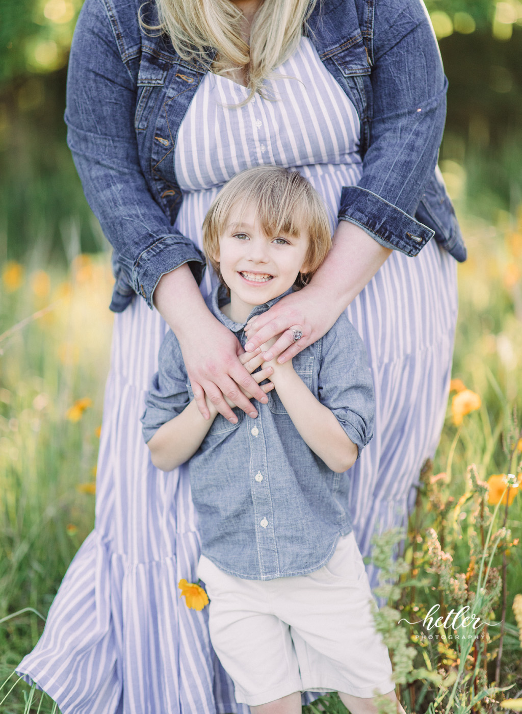 Fremont Michigan family photos in a field of yellow wildflowers