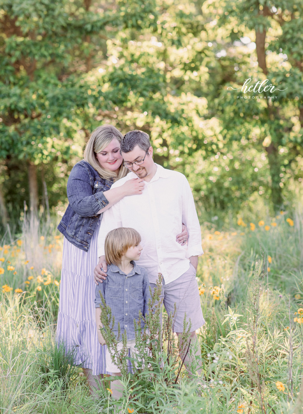 Fremont Michigan family photos in a field of yellow wildflowers