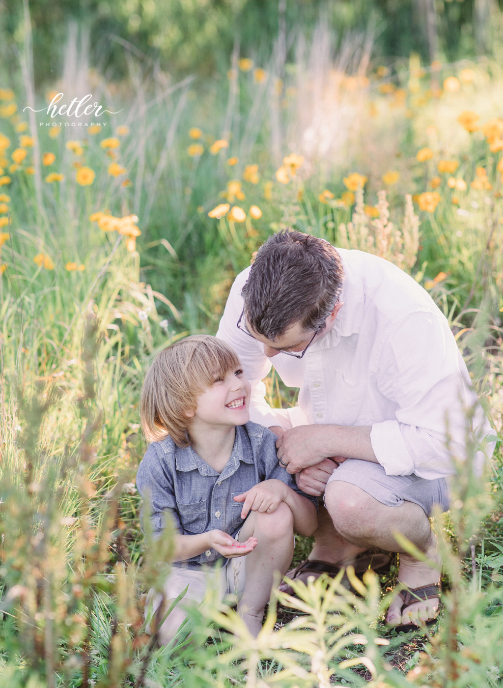 Fremont Michigan family photos in a field of yellow wildflowers