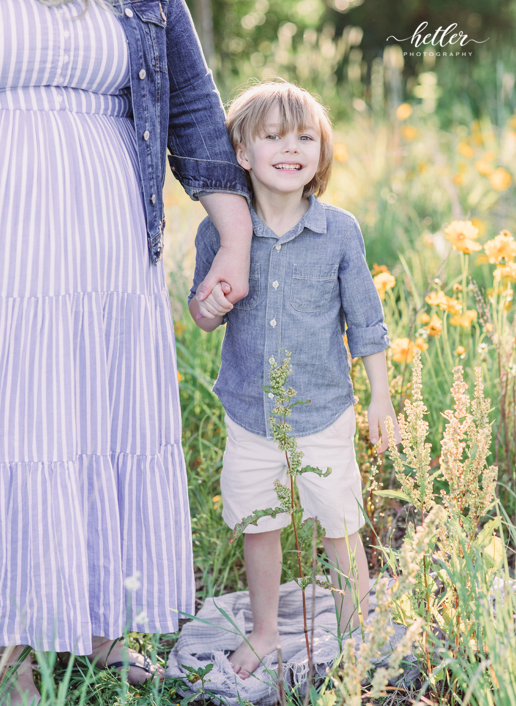 Fremont Michigan family photos in a field of yellow wildflowers