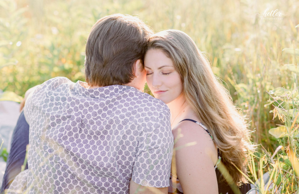 West Michigan couple photography in a field of wildflowers and lavender at Shades of Lavender Farm in Kalamazoo