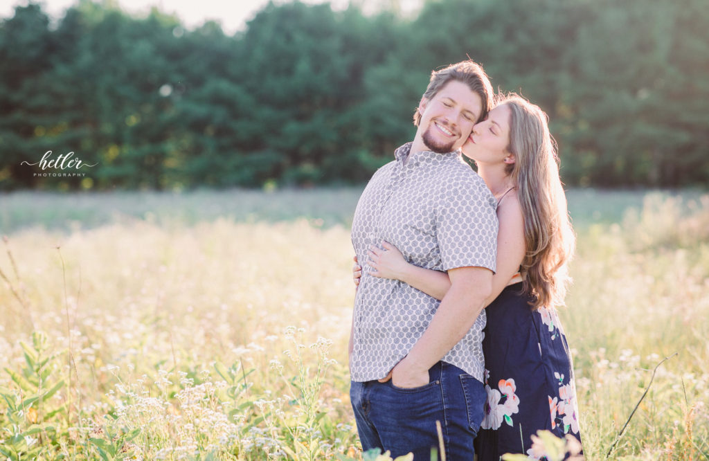 West Michigan couple photography in a field of wildflowers and lavender at Shades of Lavender Farm in Kalamazoo