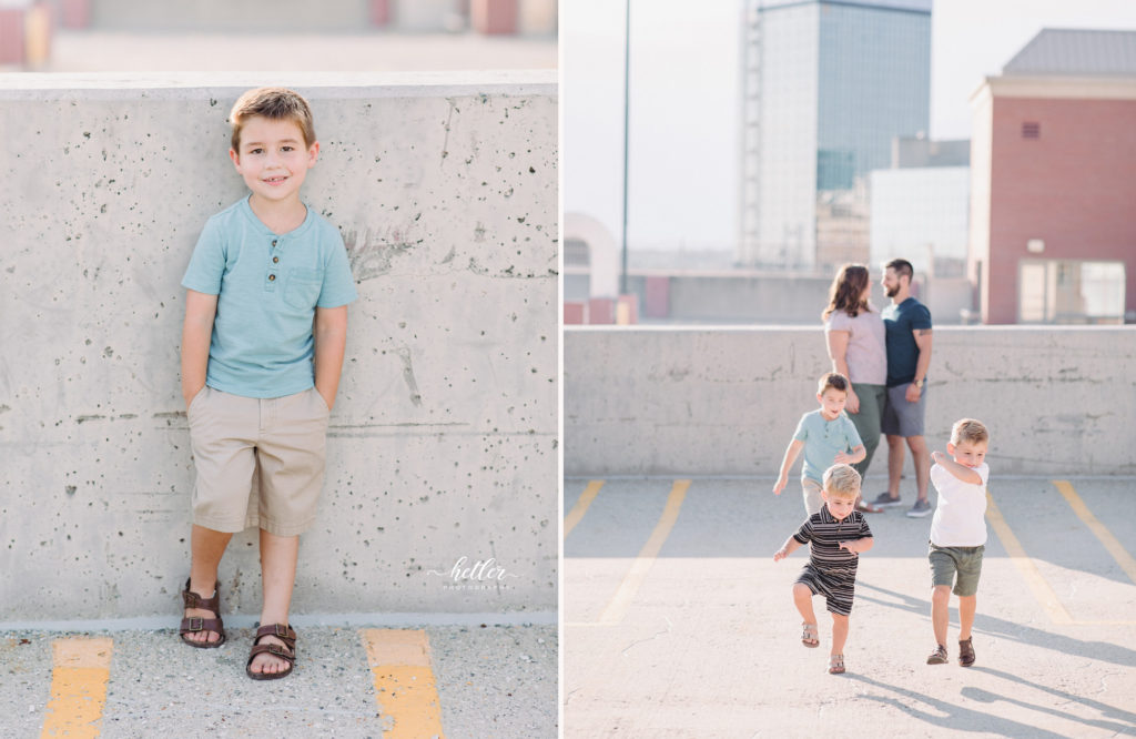 Downtown Grand Rapids family pics on a parking garage rooftop with views of the city and with a white breeze block wall