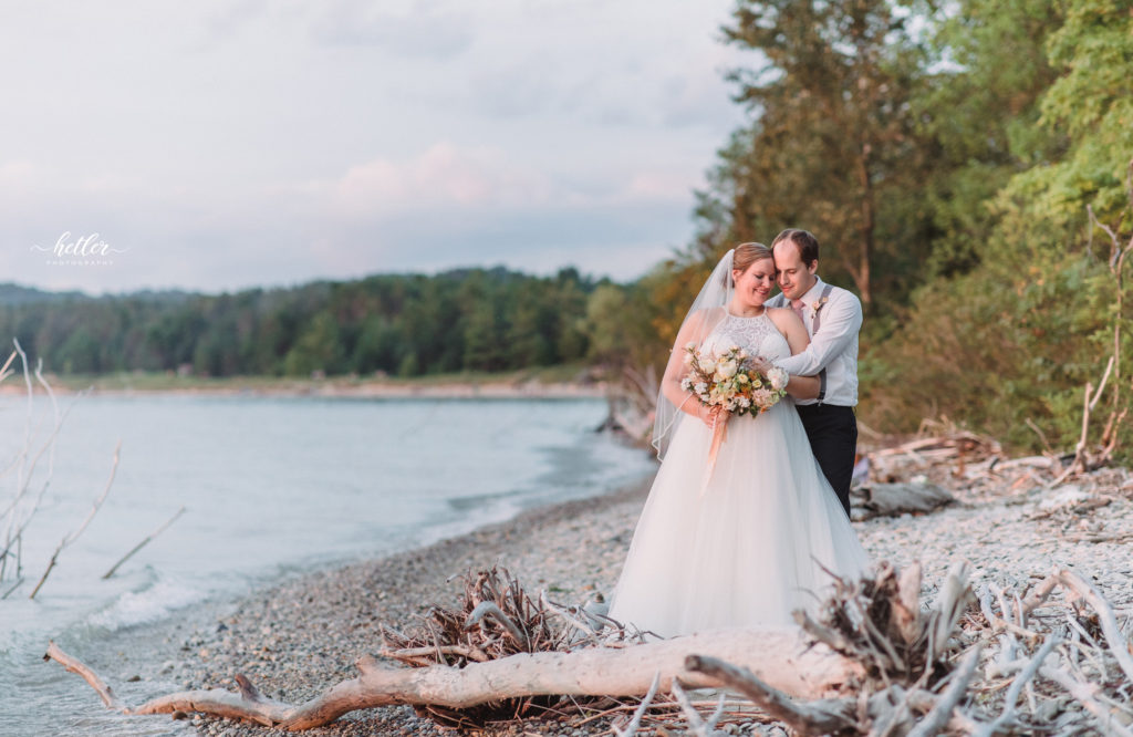 Petoskey wedding photos to celebrate a rescheduled wedding due to Covid with a gorgeous sunset