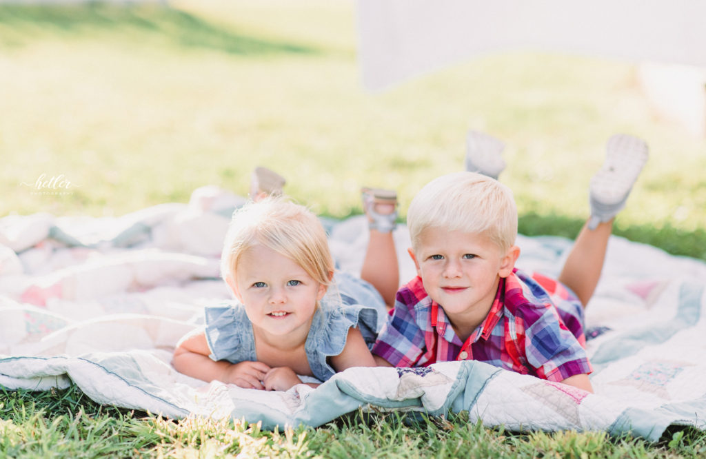 Grand Rapids clothesline mini session in a backyard setting with two adorable siblings