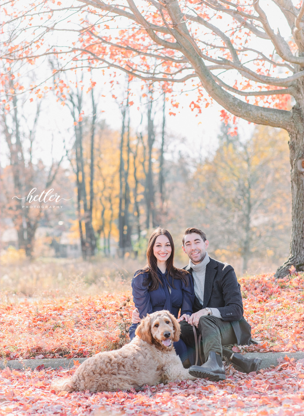 Couple photo session at The Highlands in Grand Rapids on a sunny fall day with the couple's Goldendoodle