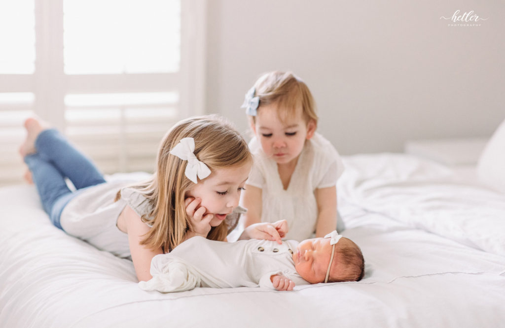 In-home newborn photos in Spring Lake Michigan for a family full of sisters and the newest, baby Margaret