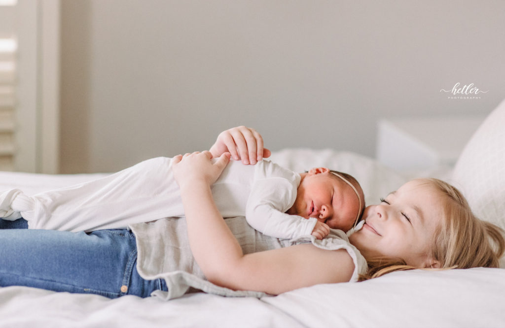 In-home newborn photos in Spring Lake Michigan for a family full of sisters and the newest, baby Margaret