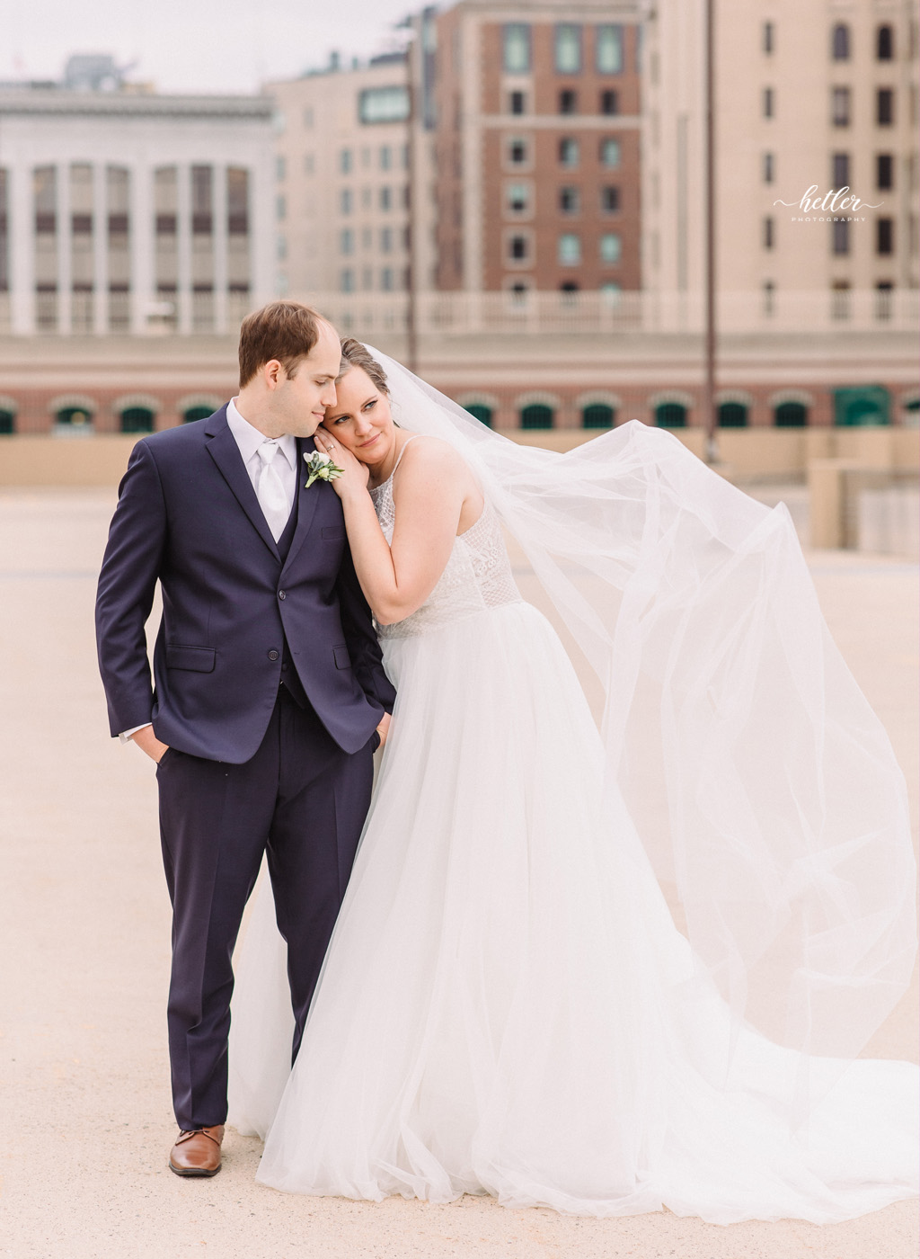 Spring warehouse wedding in downtown Grand Rapids Michigan at Studio D2D with dusty rose and navy colors