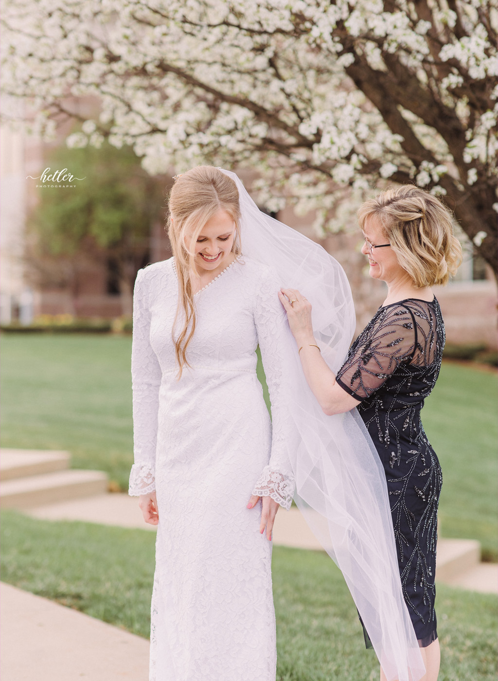 Spring wedding in Warsaw Indiana with a lace wedding gown and cathedral veil