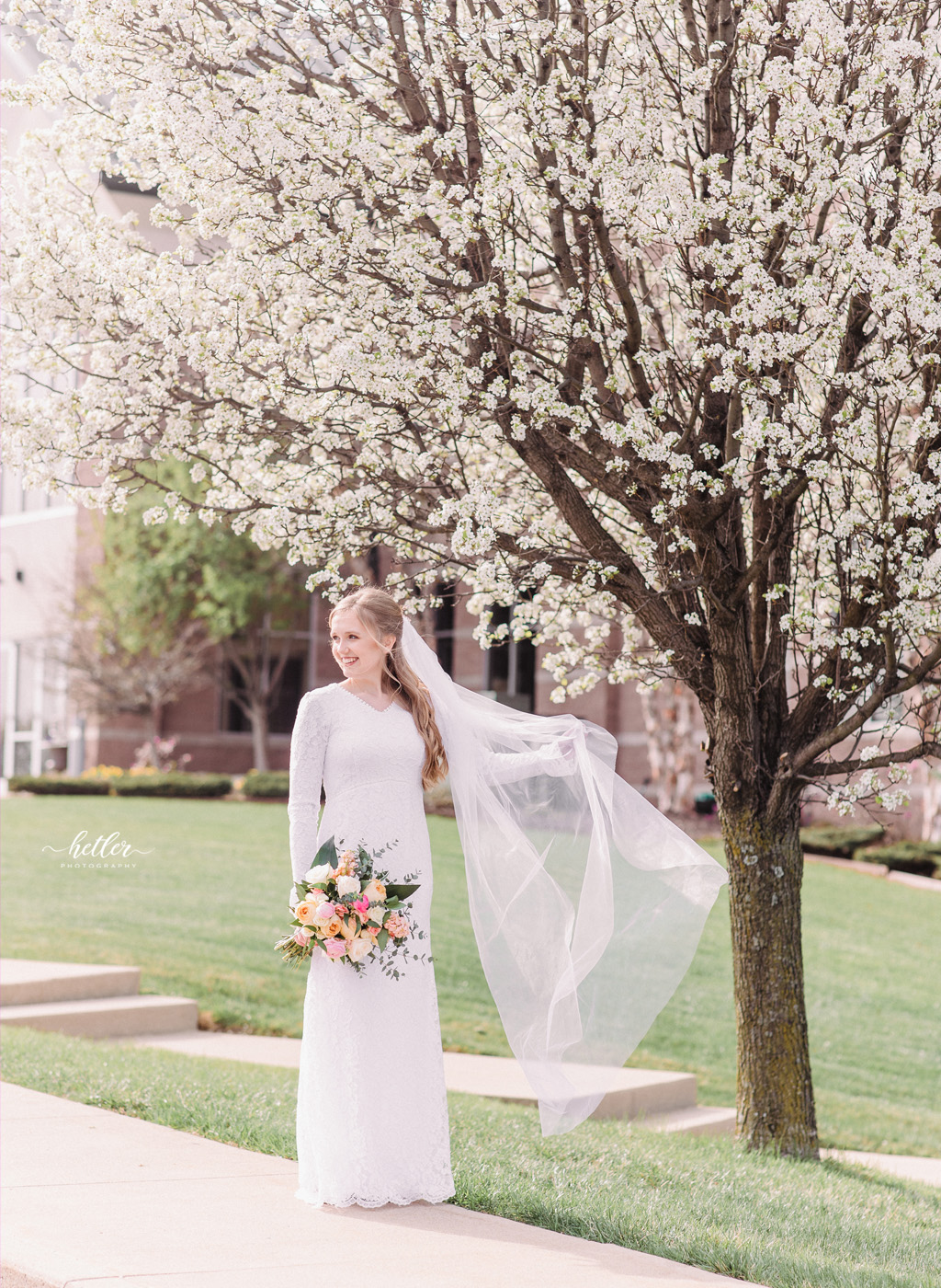Spring wedding in Warsaw Indiana with a lace wedding gown and cathedral veil