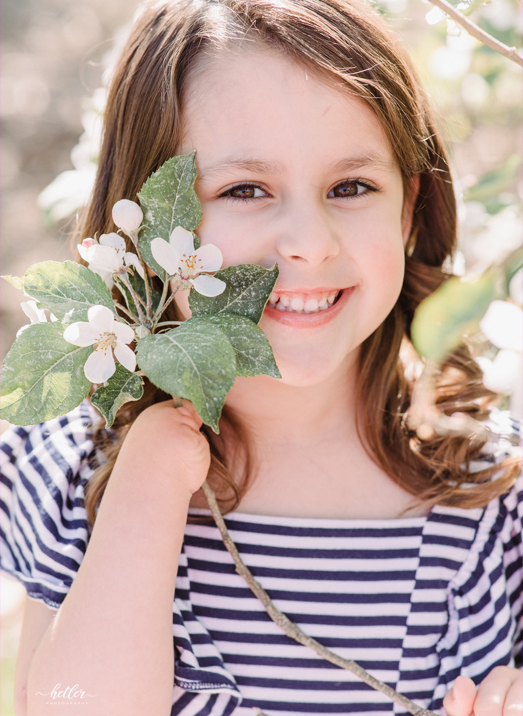 Grand Rapids Michigan children session at an orchard full of apple blossoms