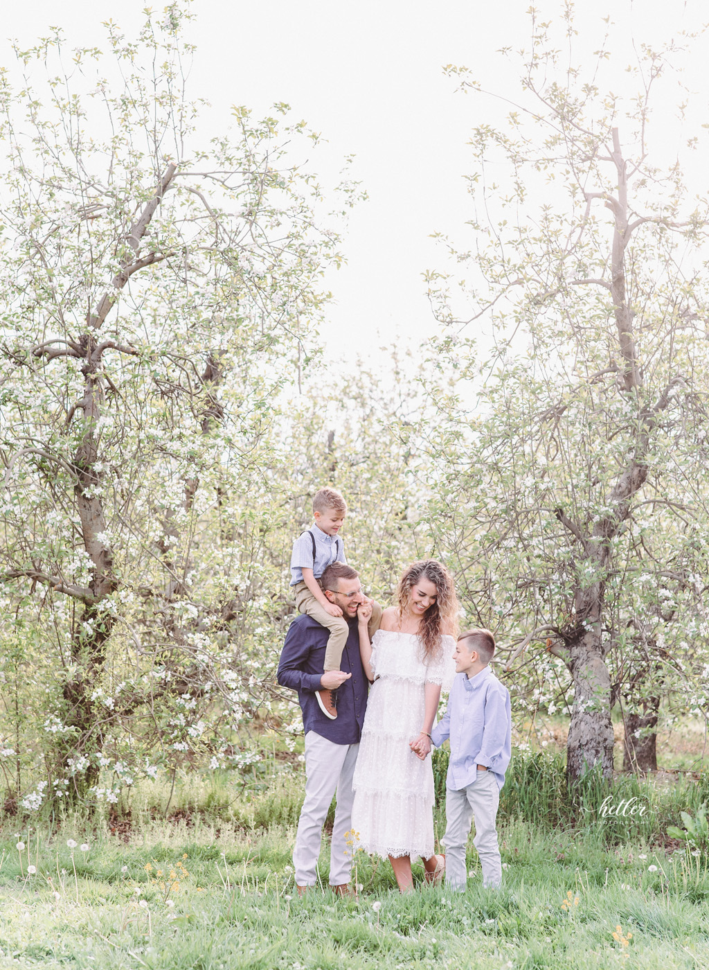Grand Rapids Michigan spring family photo session at an apple orchard full of apple blossoms