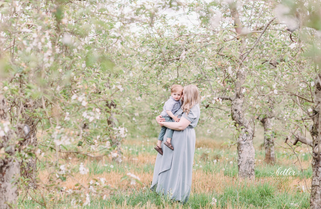 Grand Rapids mom and me sessions with mommas and their babies at a local apple orchard full of apple blossoms