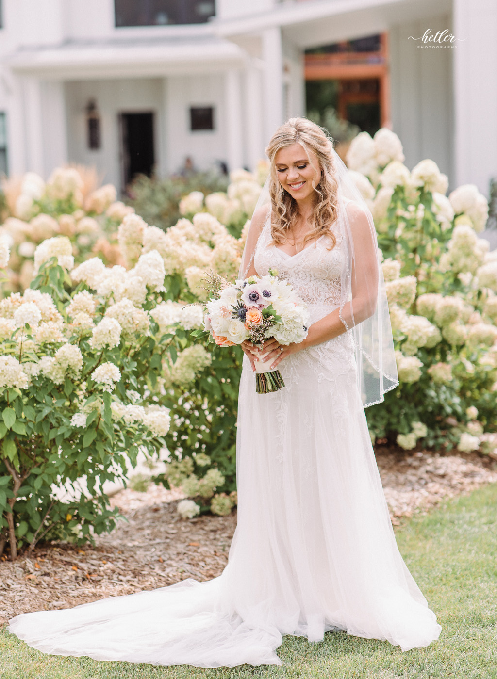 Blush and navy Labor Day wedding at Bay Pointe Woods in Shelbyville Michigan
