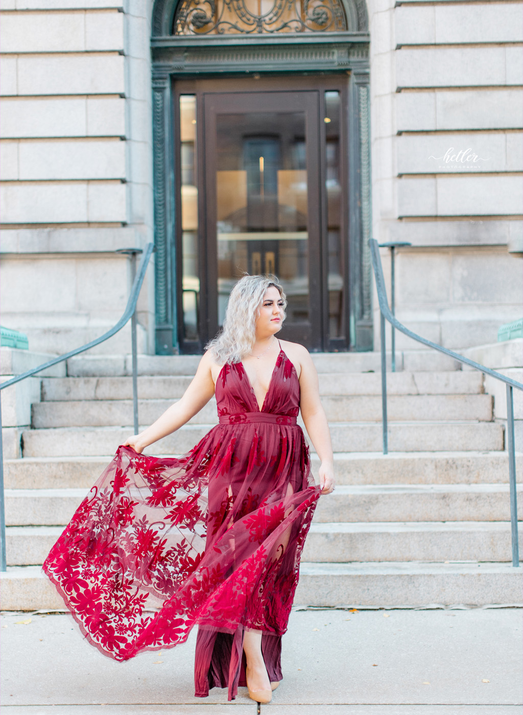 Grand Rapids Michigan engagement photos in downtown with a bride to be in a stunning red dress