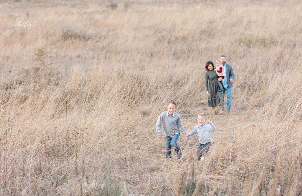 Fall family photos in a golden field in Rockford Michigan