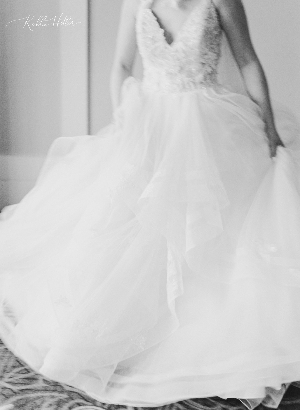bride twirling in tulle wedding dress