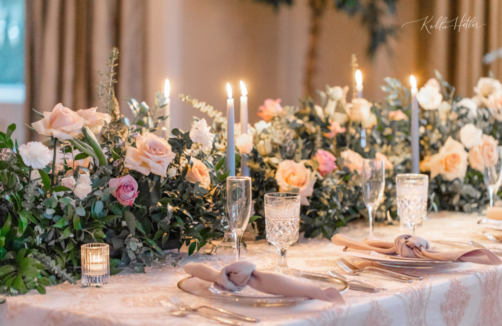 wedding reception tablescape with lit candles