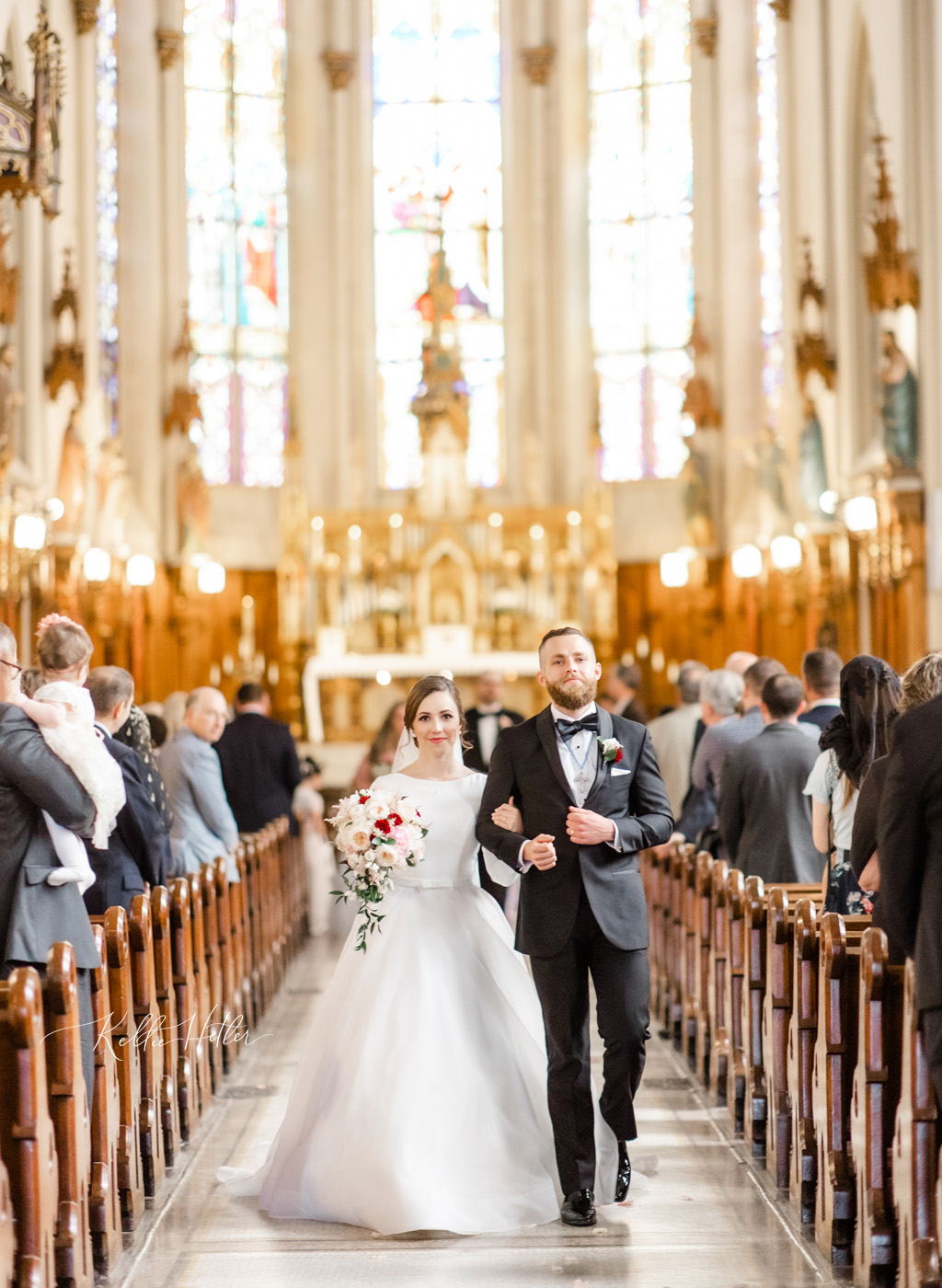 newly married bride and groom in gorgeous church in detroit