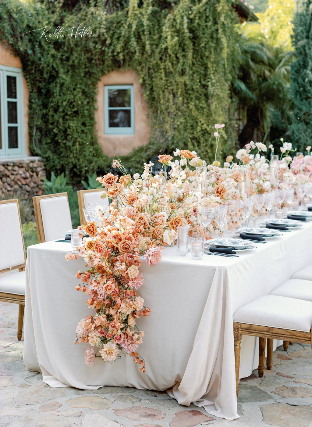 cascading flowers down reception table