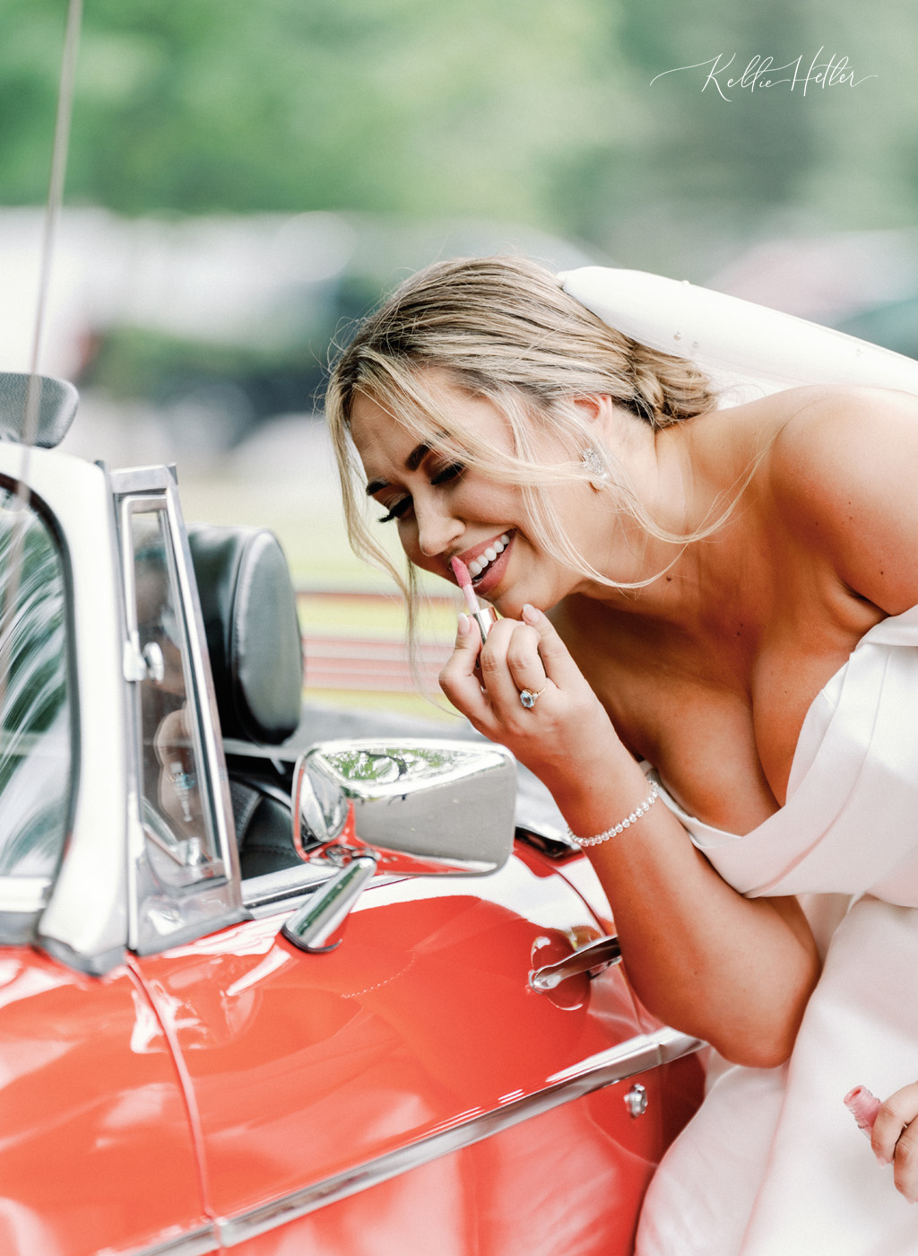 bridal portrait with red classic car